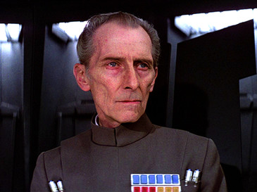 Peter Cushing as Grand Moff Tarkin in Star Wars Episode IV: A New Hope | By Lucasfilm - Blu-ray release of Star Wars Episode IV: A New Hope., Fair use, https://en.wikipedia.org/w/index.php?curid=37555092