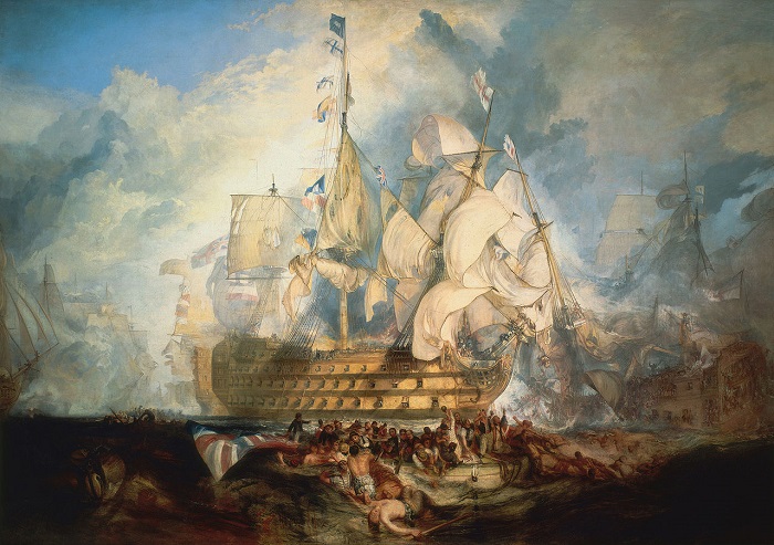 La Bataille de Trafalgar par Turner (1822–1824) montre les trois dernières lettres du célèbre pavillon « England expects that every man will do his duty » sur le HMS Victory | Par Joseph Mallord William Turner — Downloaded from http://www.nmm.ac.uk/mag/images/700/BHC0565_700.jpg, Domaine public, https://commons.wikimedia.org/w/index.php?curid=111535