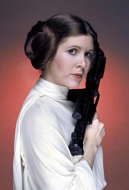 Princess Leia and her characteristic hairstyle from Star Wars (1977) | By Lucasfilm/Sportsphoto Ltd/Allstar - Reduced from http://assets.nydailynews.com/polopoly_fs/1.2405755.1445445992!/img/httpImage/image.jpg_gen/derivatives/article_970/lvfisher22n-4-web.jpg?, Fair use, https://en.wikipedia.org/w/index.php?curid=35938485